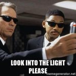 men-in-black-look-into-the-light-please.jpg